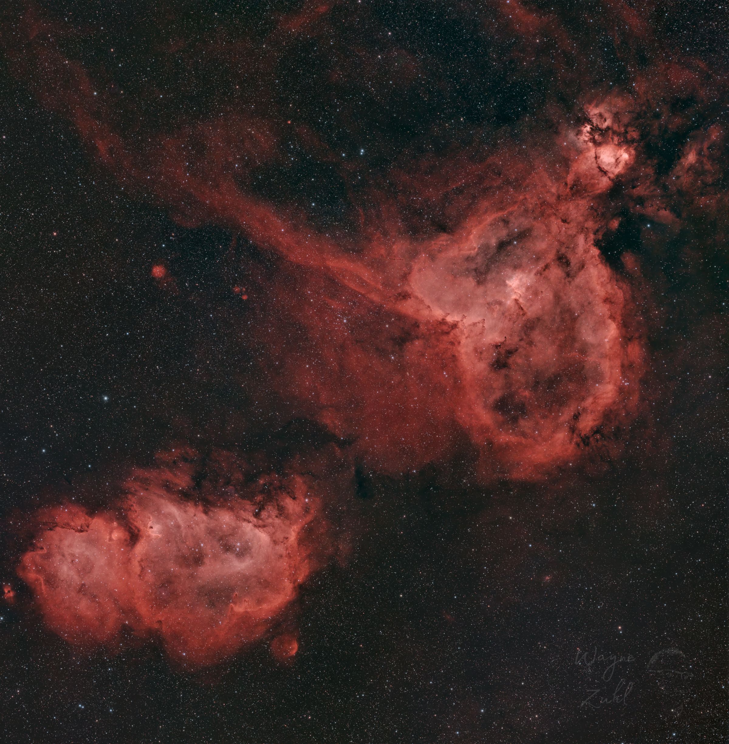 Heart and Soul Nebulae IC 1805 and IC 1848 wide-field astrophotography image in Cassiopeia